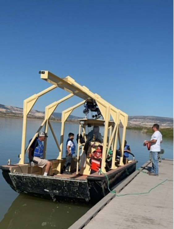 Abiquiu Lake staff take volunteers out on the maintenance boat to pick up lake and shoreline trash, Sept. 28, 2024.